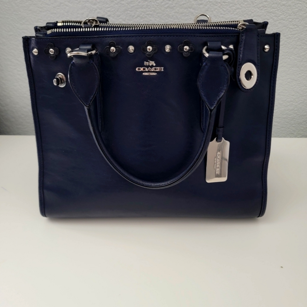 Coach navy handbag with silver studs.